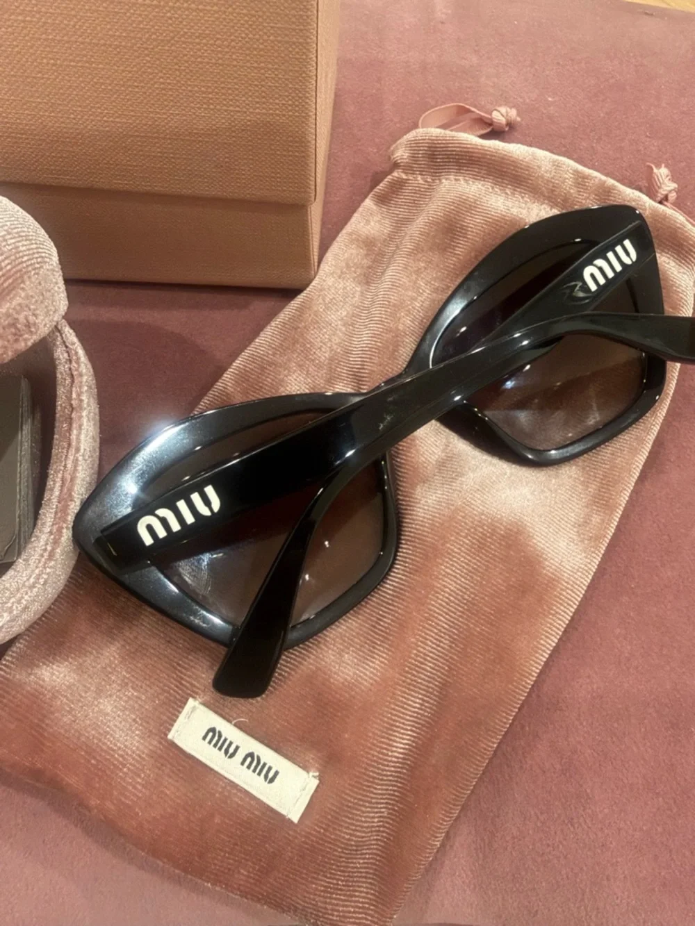 Miu Miu Black Cat-Eye Sunglasses with Dark Lenses